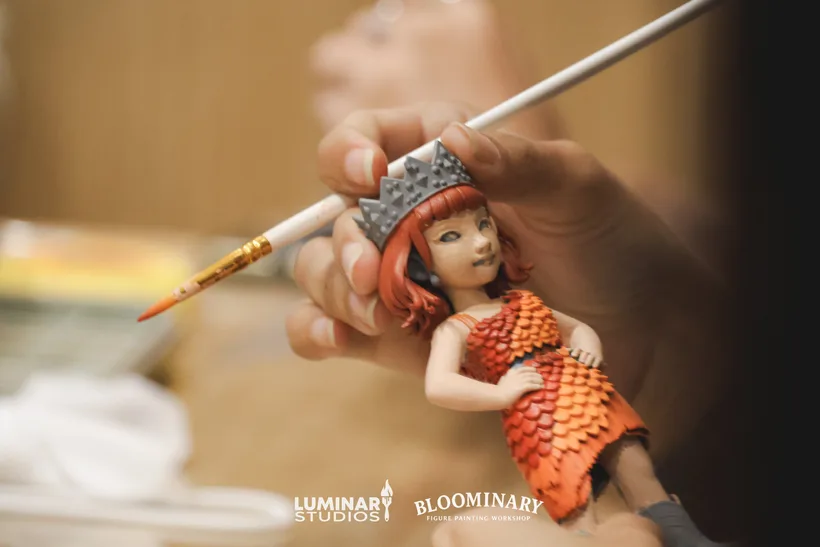 Fine brush detail during a workshop